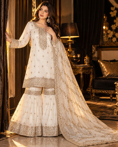 Noor-e-Zari ivory chiffon stitched medium gharara suit with gold zari embroidery and light sequins
